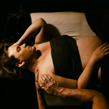 Pregnant woman receiving The Mama Diva Prenatal Spa Package from a licensed massage therapist at Viva Day Spa + Med Spa in Austin, TX.