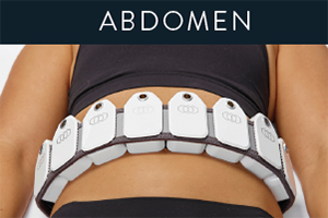 Woman's stomach with eight Evolve Tite body remodeling applicators on her lower abdomen before a skin tightening and body remodeling session.