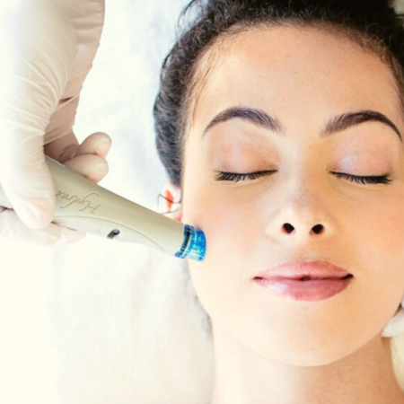 Close-up of a woman with her eyes closed receiving a HydraFacial treatment