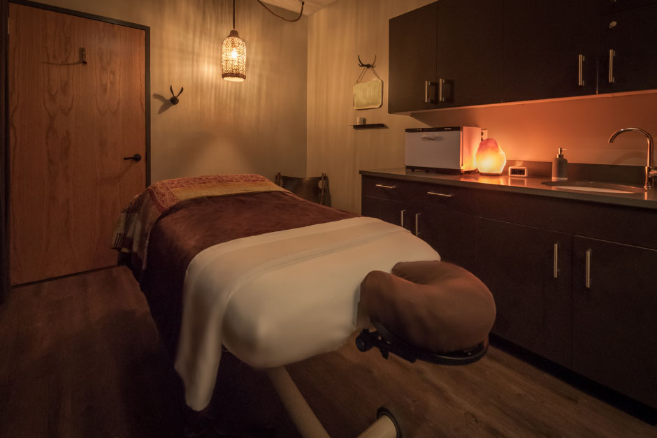 Interior of a treatment room with a massage table at Viva Day Spa + Med Spa at the Domain Northside in Austin, Tx.