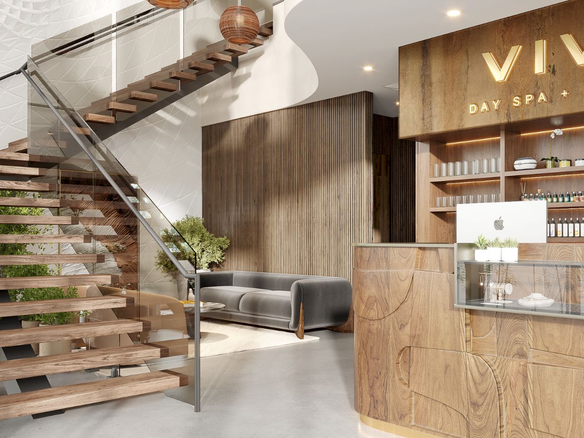 Interior image of the first floor entrance and grand staircase of Viva Day Spa + Med Spa in Dallas, with natural light reflecting on the beautiful modern interior.